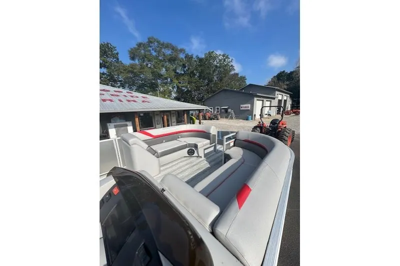 Slide: The Image of 2025 Bennington 22 SSXB pontoon boat with spacious seating and modern design. - 11