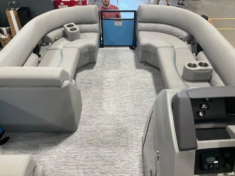 Slide: The Image of 2025 Bennington 22 LSB pontoon boat interior with plush seating and cup holders. - 4