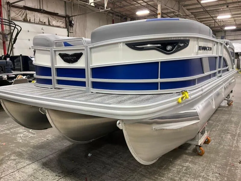 Slide: The Image of 2025 Bennington 22 MFB pontoon boat in a warehouse setting. - 3