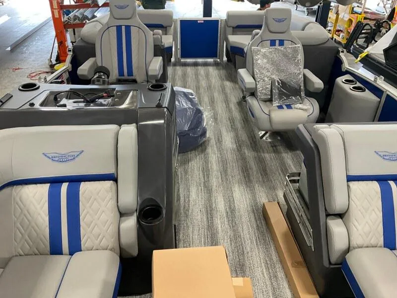 Slide: The Image of Interior of 2025 Bennington 22 MFB boat with modern seating and blue accents. - 5