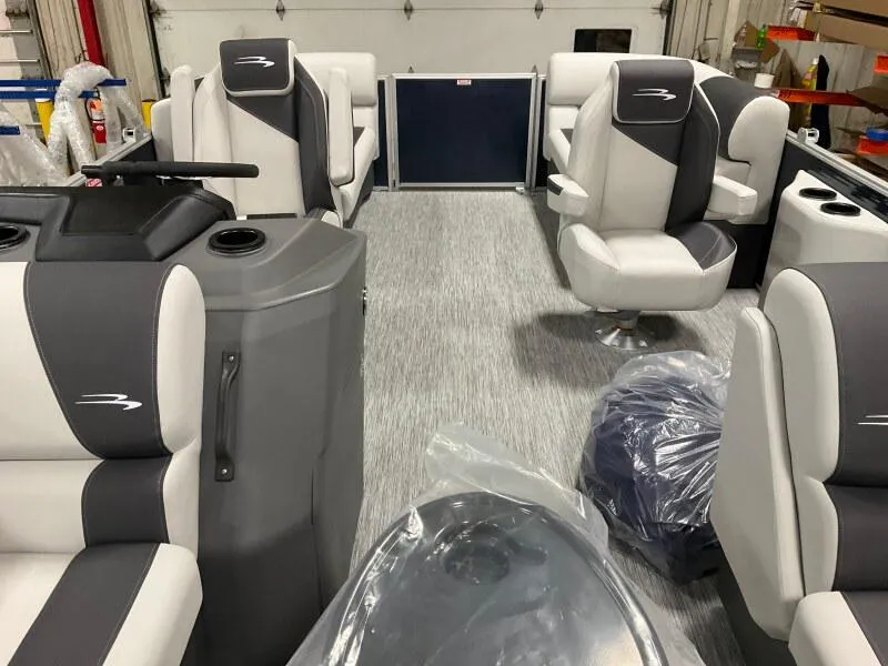 Slide: The Image of 2025 Bennington S 22 SSR pontoon boat interior with gray and white seating. - 10