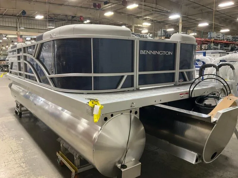 Slide: The Image of 2025 Bennington S 22 SSR pontoon boat in a warehouse setting. - 3