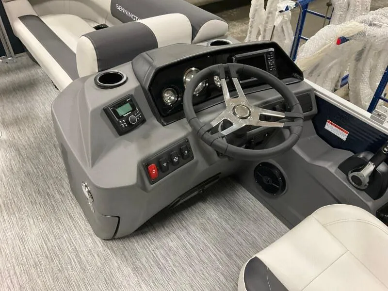 Slide: The Image of 2025 Bennington S 22 SSR boat dashboard with steering wheel and controls. - 7