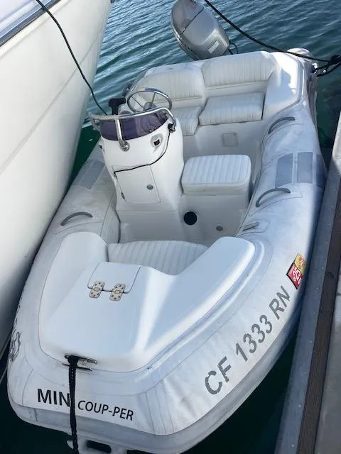 Slide: The Image of Inflatable boat docked beside a Sea Ray 380 Sundancer, 1999 model. - 25