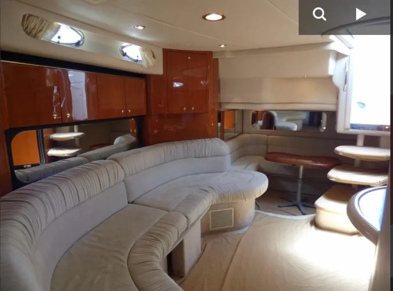 Slide: The Image of Luxurious interior of 1999 Sea Ray 380 Sundancer yacht with plush seating and elegant wood finishes. - 8