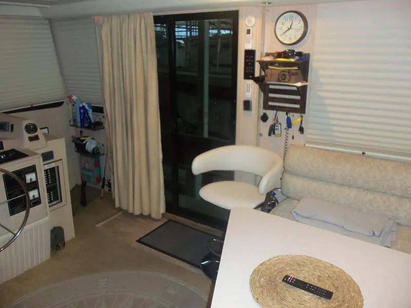 Slide: The Image of Interior of a 2003 Gibson Classic boat with seating, helm, and decor. - 31
