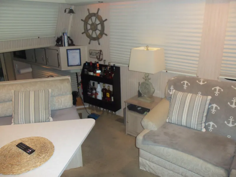Slide: The Image of Cozy boat interior with nautical decor, featuring a bar area and comfortable seating. - 33
