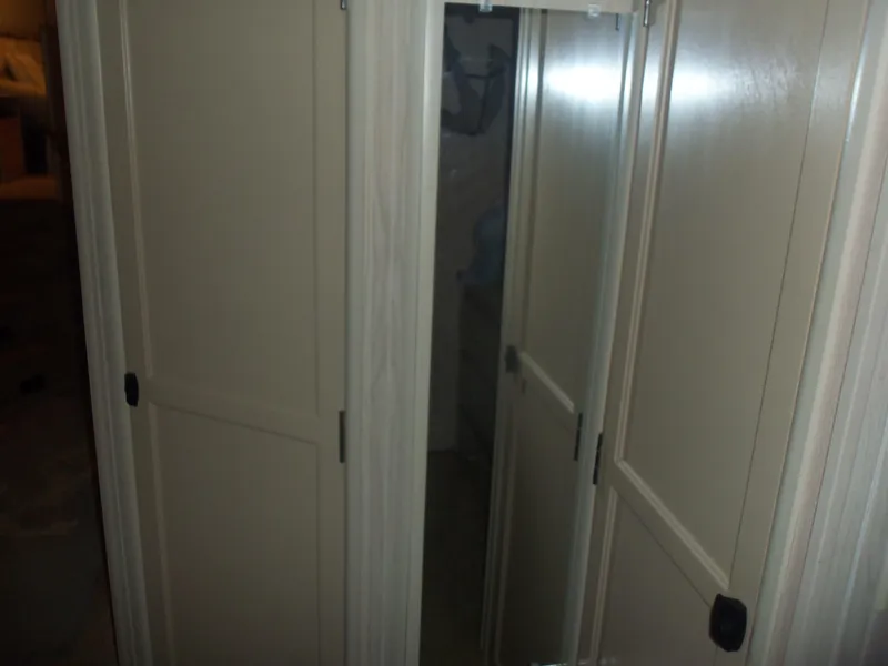 Slide: The Image of Cream-colored wooden sliding doors in a dimly lit room. - 39