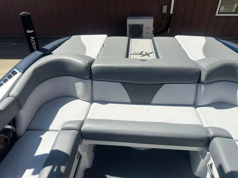 Slide: The Image of 2020 MasterCraft XT20 boat interior with gray and white seating. - 13