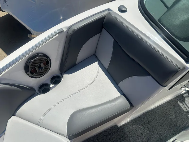 Slide: The Image of 2020 MasterCraft XT20 boat interior with gray seating and speaker. - 15