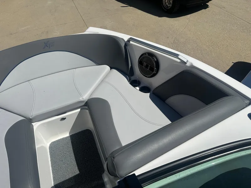 Slide: The Image of 2020 MasterCraft XT20 boat interior with gray seating and speaker system. - 5