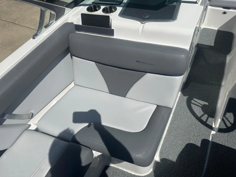 Slide: The Image of 2020 MasterCraft XT20 boat interior with gray and white seating. - 8