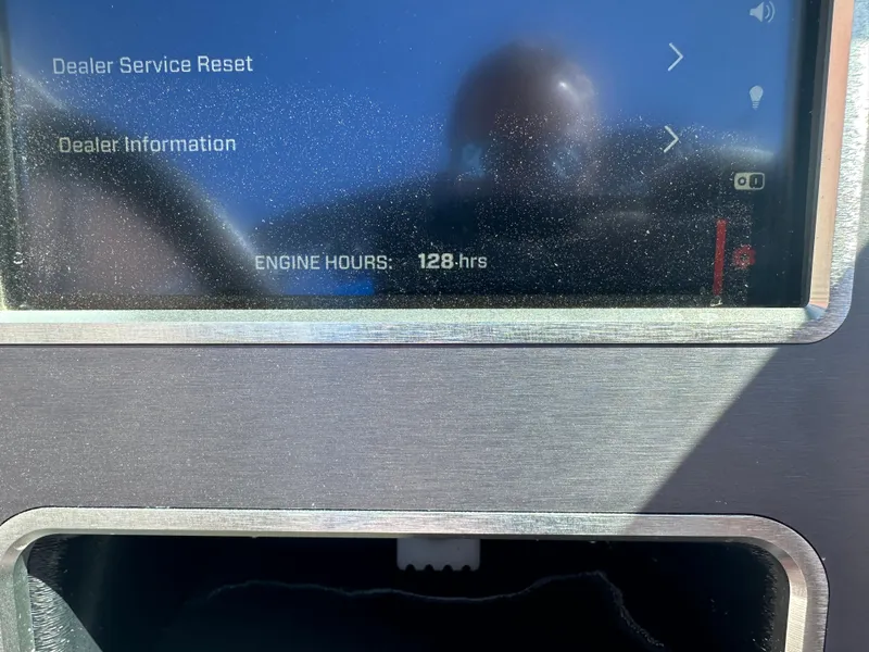 Slide: The Image of Dashboard display of 2020 MasterCraft XT20 showing 128 engine hours. - 9