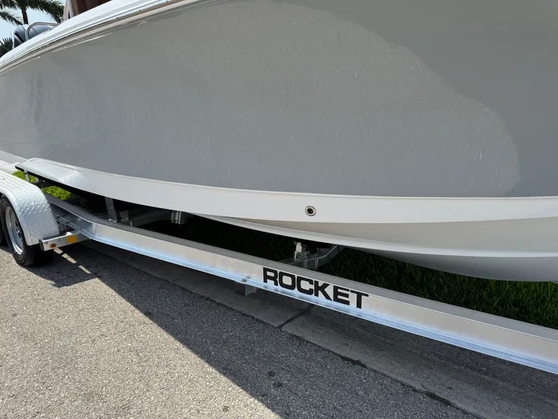 Slide: The Image of 2022 Sea Hunt Ultra 234 boat on Rocket trailer, side view. - 27