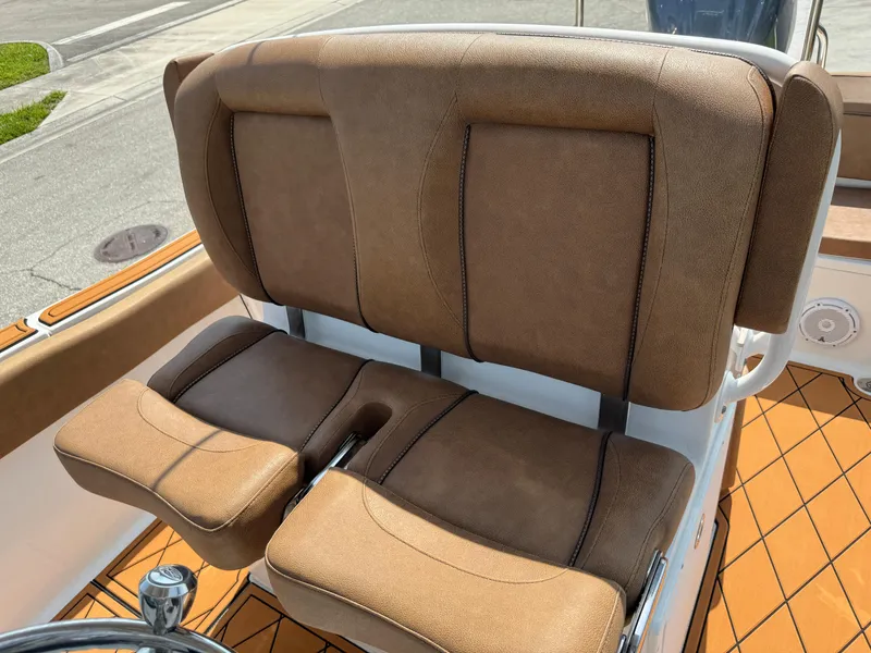 Slide: The Image of 2022 Sea Hunt Ultra 234 boat seats with brown upholstery and adjustable backrests. - 39