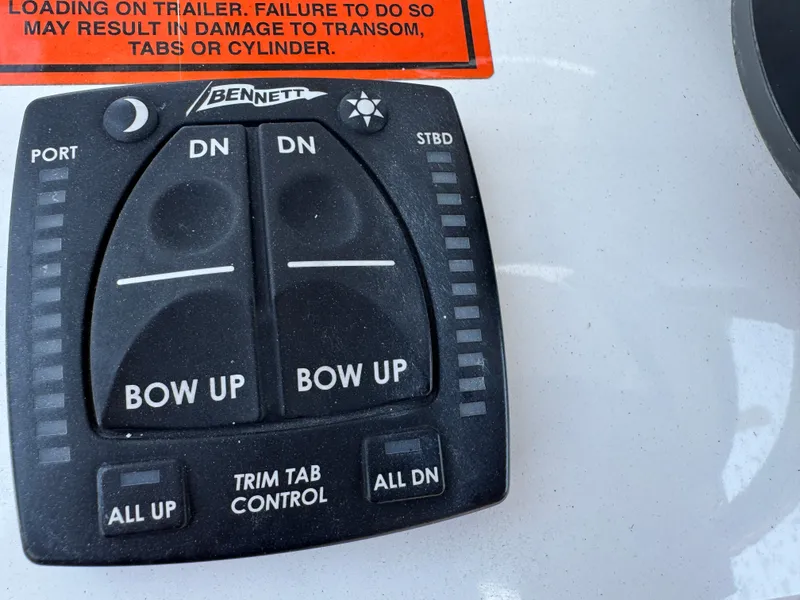 Slide: The Image of Trim tab control panel on 2022 Sea Hunt Ultra 234 boat. - 44