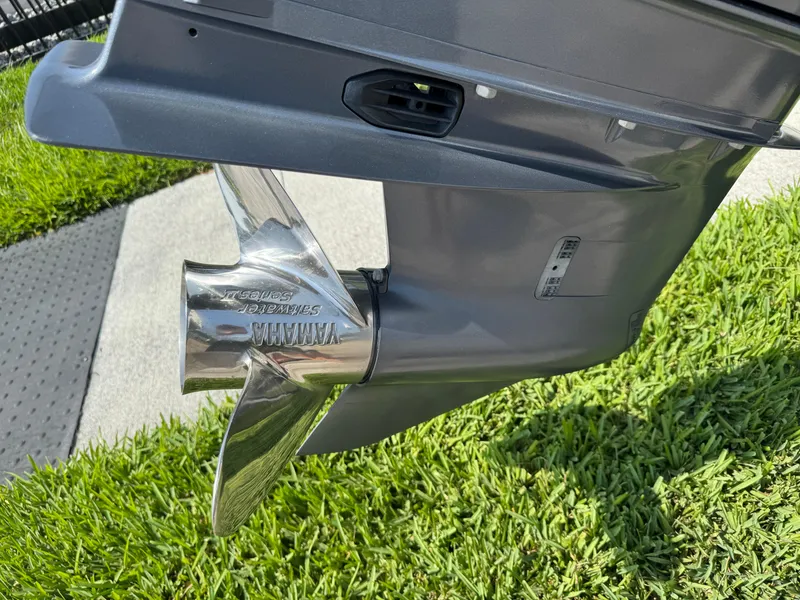 Slide: The Image of Propeller of 2022 Sea Hunt Ultra 234 boat on grass background. - 9