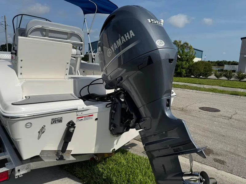 Slide: The Image of 2019 Sea Fox 206 Commander boat with Yamaha 150 engine, parked on a sunny day. - 13