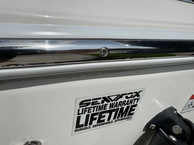 Slide: The Image of 2019 Sea Fox 206 Commander with lifetime warranty sticker, showcasing durability and dependability. - 15