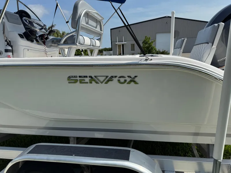 Slide: The Image of 2019 Sea Fox 206 Commander boat on trailer, side view with logo visible. - 20