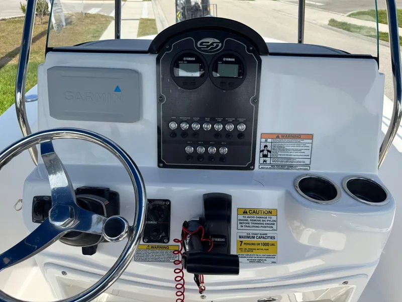 Slide: The Image of 2019 Sea Fox 206 Commander boat dashboard with steering wheel and control panel. - 29