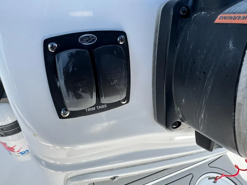 Slide: The Image of Control panel of a 2019 Sea Fox 206 Commander boat with trim tab switches. - 30