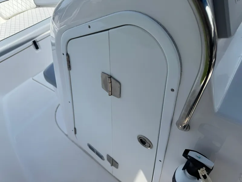 Slide: The Image of 2019 Sea Fox 206 Commander boat console with storage compartment and safety equipment. - 39
