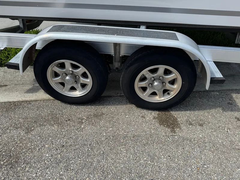 Slide: The Image of Trailer wheels of a 2019 Sea Fox 206 Commander boat on pavement. - 4