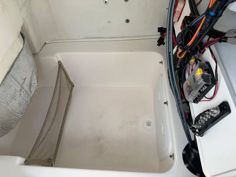 Slide: The Image of 2019 Sea Fox 206 Commander boat compartment with wiring and storage net. - 41