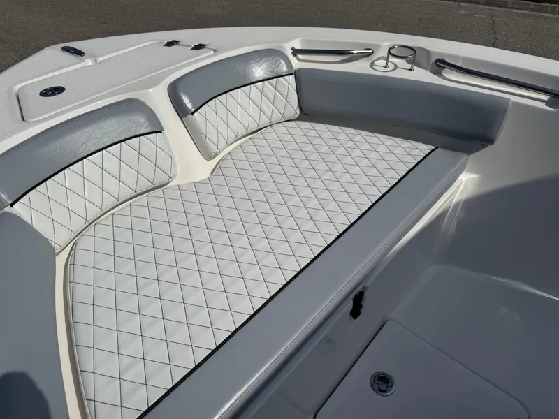 Slide: The Image of 2019 Sea Fox 206 Commander boat interior with cushioned seating and diamond pattern upholstery. - 49