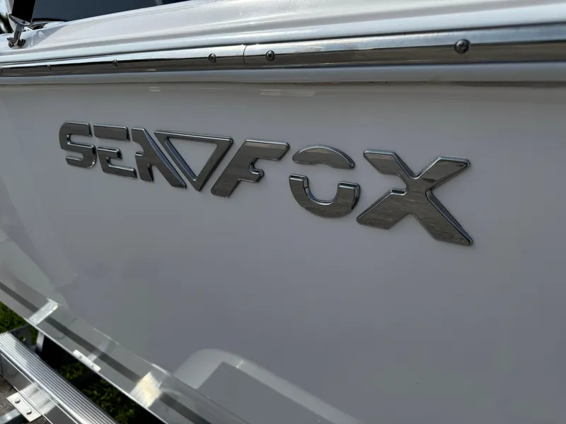 Slide: The Image of Close-up of 2019 Sea Fox 206 Commander boat logo on white hull. - 5