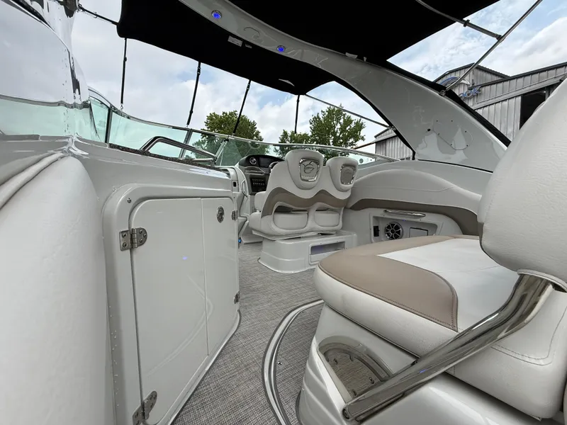 Slide: The Image of 2023 Crownline 264 CR boat interior with modern seating and sleek design. - 12