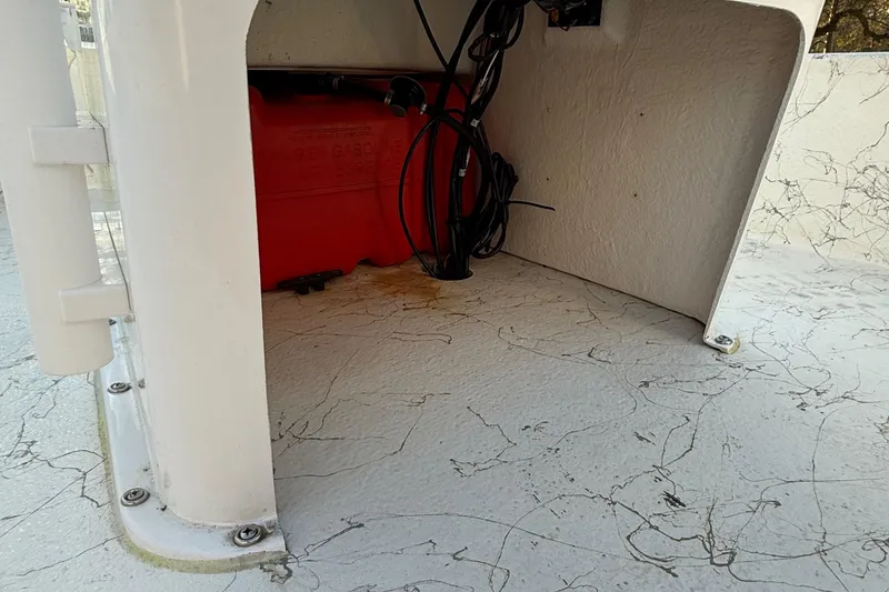 Slide: The Image of 2023 Coastal Skiff 171 interior showing wiring and storage compartment. - 10