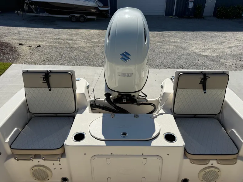 Slide: The Image of 2020 Carolina Skiff 21LS Dual Console with Suzuki outboard motor, rear seating view. - 13