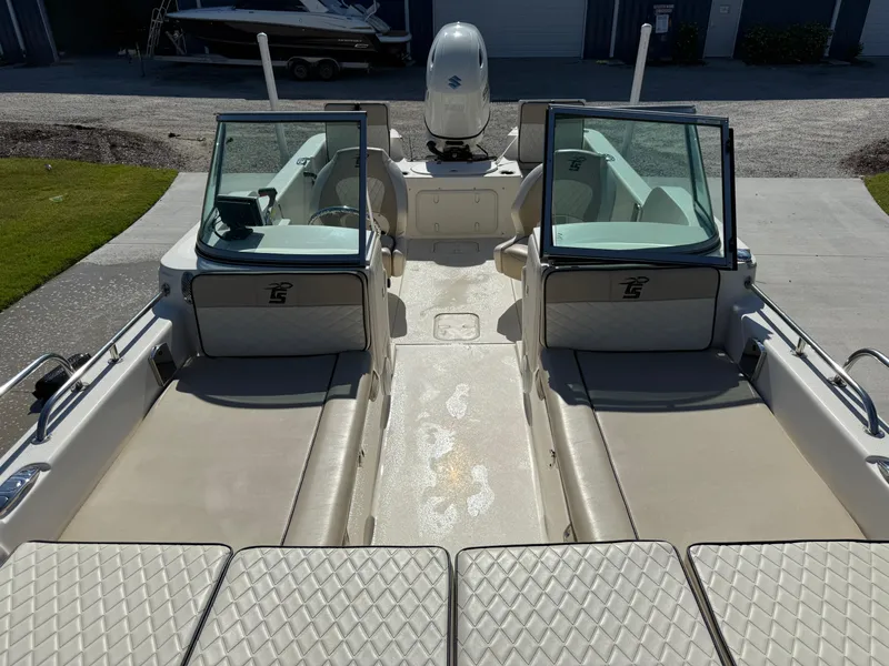 Slide: The Image of 2020 Carolina Skiff 21LS Dual Console boat interior with seating and windshield. - 16