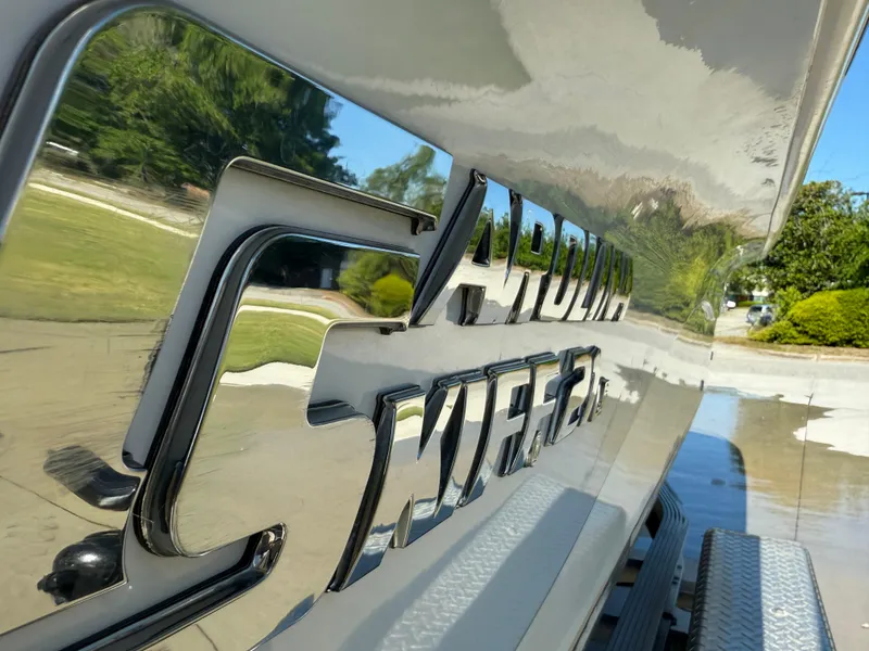 Slide: The Image of 2020 Carolina Skiff 21LS Dual Console boat with reflective logo detail. - 17