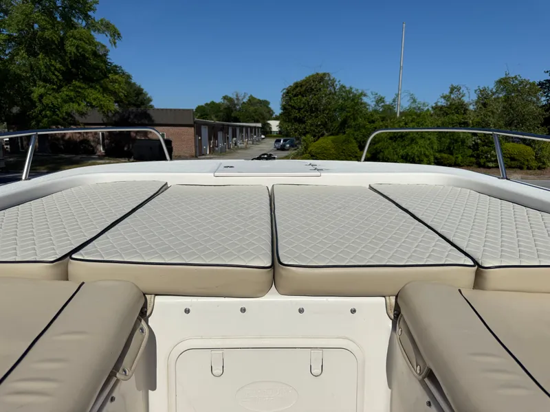 Slide: The Image of 2020 Carolina Skiff 21LS Dual Console boat with cushioned seating and open deck view. - 20