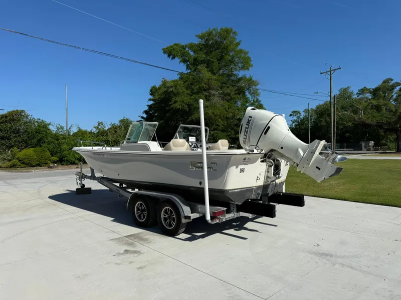 Slide: The Image of 2020 Carolina Skiff 21LS Dual Console boat on trailer, parked outdoors. - 4