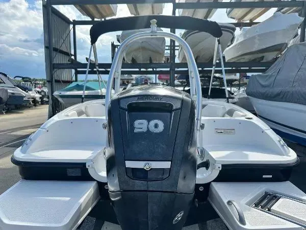 Slide: The Image of 2015 Bayliner Element E180 boat with Mercury 90 engine, docked in a marina. - 5