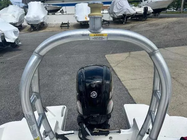 Slide: The Image of 2015 Bayliner Element E180 boat engine and frame at a marina. - 8