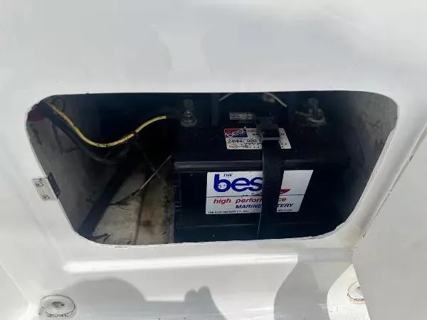 Slide: The Image of Battery compartment of 2015 Bayliner Element E180 boat, featuring a high-performance marine battery. - 9