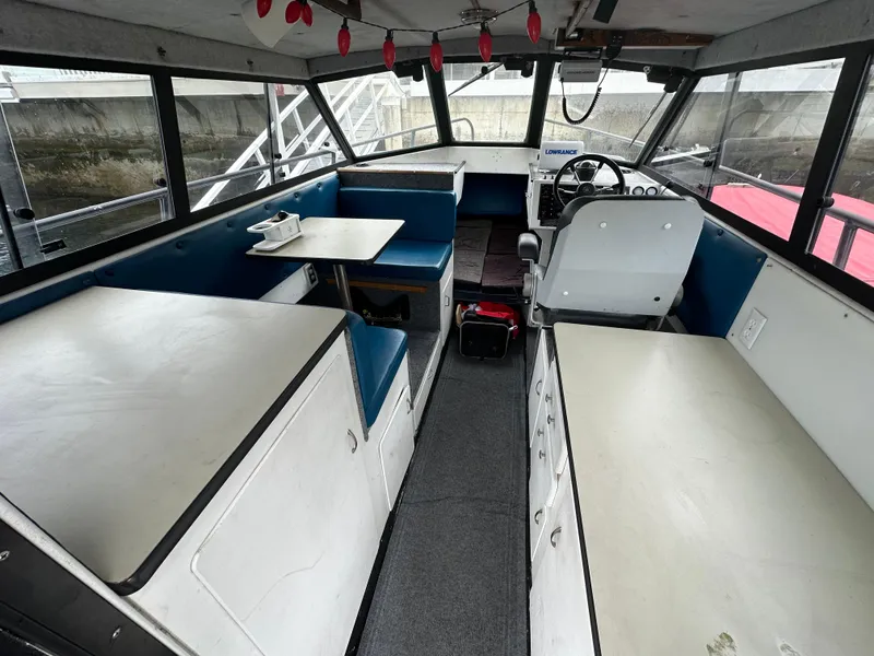 Slide: The Image of 1995 Almar 26 Sounder boat deck with non-slip flooring, docked at marina. - 13