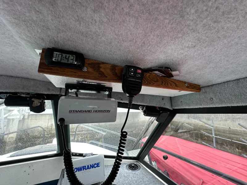 Slide: The Image of Engine compartment of a 1995 Almar 26 Sounder boat, showcasing mechanical components. - 16