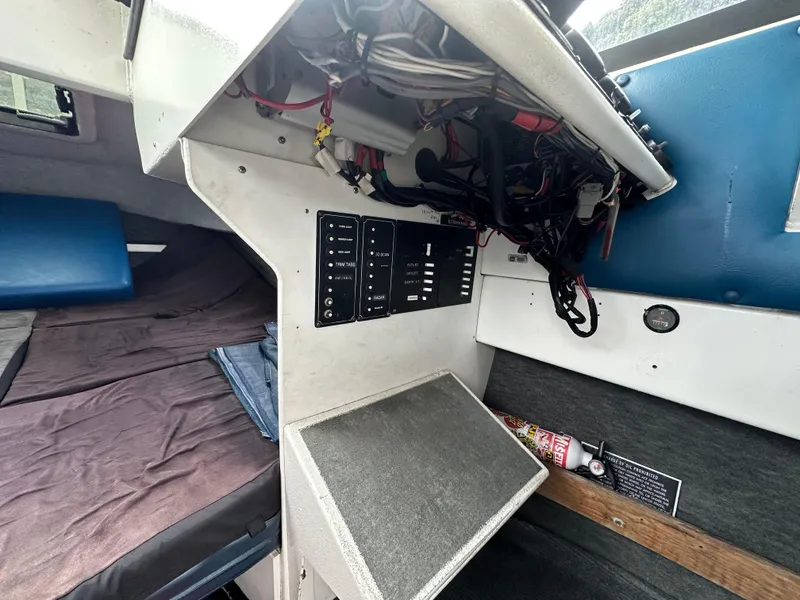 Slide: The Image of Engine compartment of a 1995 Almar 26 Sounder boat, showcasing detailed mechanical components. - 17