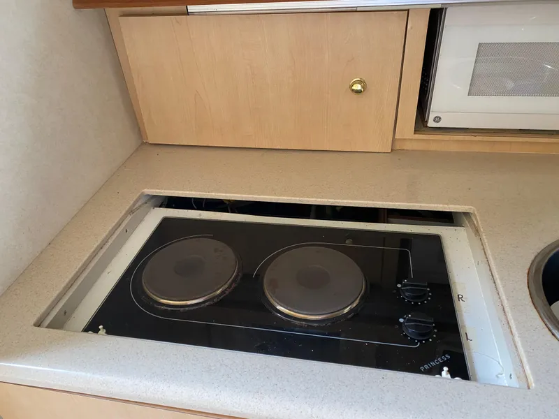 Slide: The Image of Built-in stovetop in 1998 Regal 292 Commodore boat kitchen area. - 17