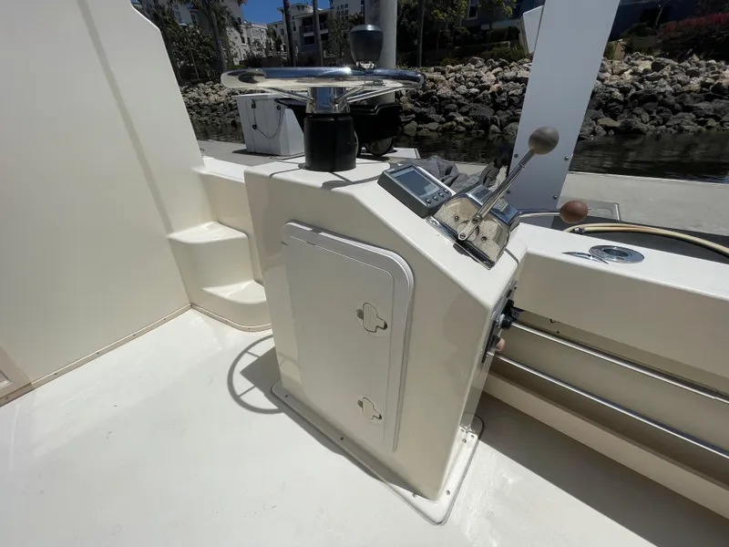 Slide: The Image of 2008 Parker 2520 XL Sport Cabin boat helm with steering wheel and controls. - 12