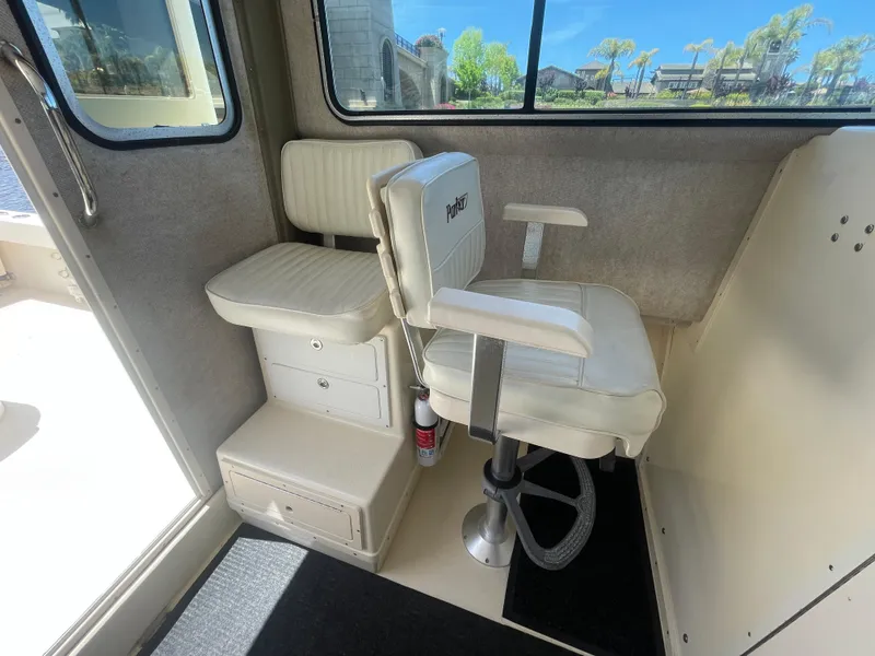 Slide: The Image of 2008 Parker 2520 XL Sport Cabin interior with white seating and window view. - 20