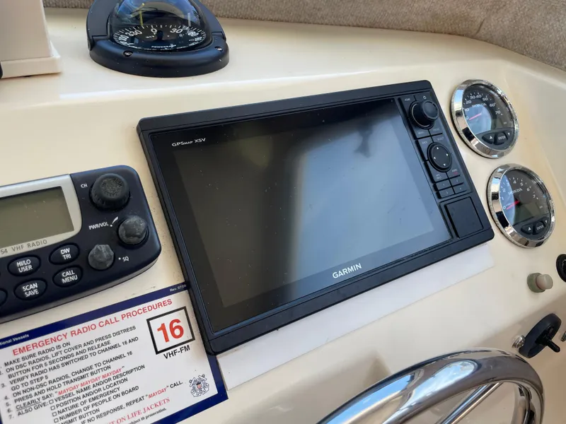 Slide: The Image of Control panel of a 2008 Parker 2520 XL Sport Cabin with Garmin GPS and radio. - 22