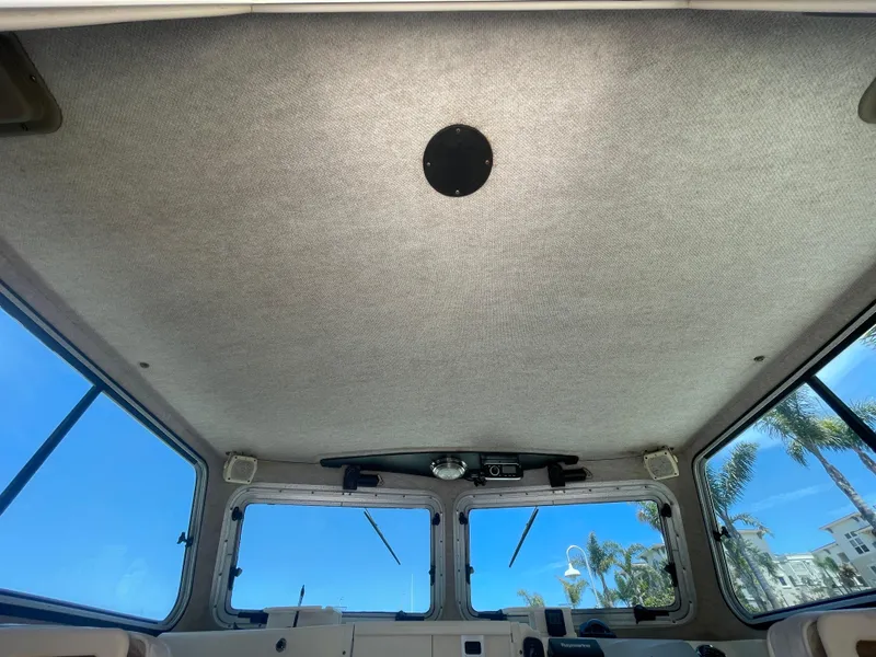 Slide: The Image of Interior view of 2008 Parker 2520 XL Sport Cabin boat with large windows. - 25