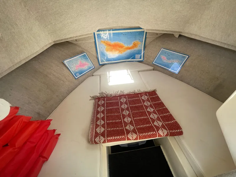 Slide: The Image of Interior of 2008 Parker 2520 XL Sport Cabin with maps and decorative curtain. - 27